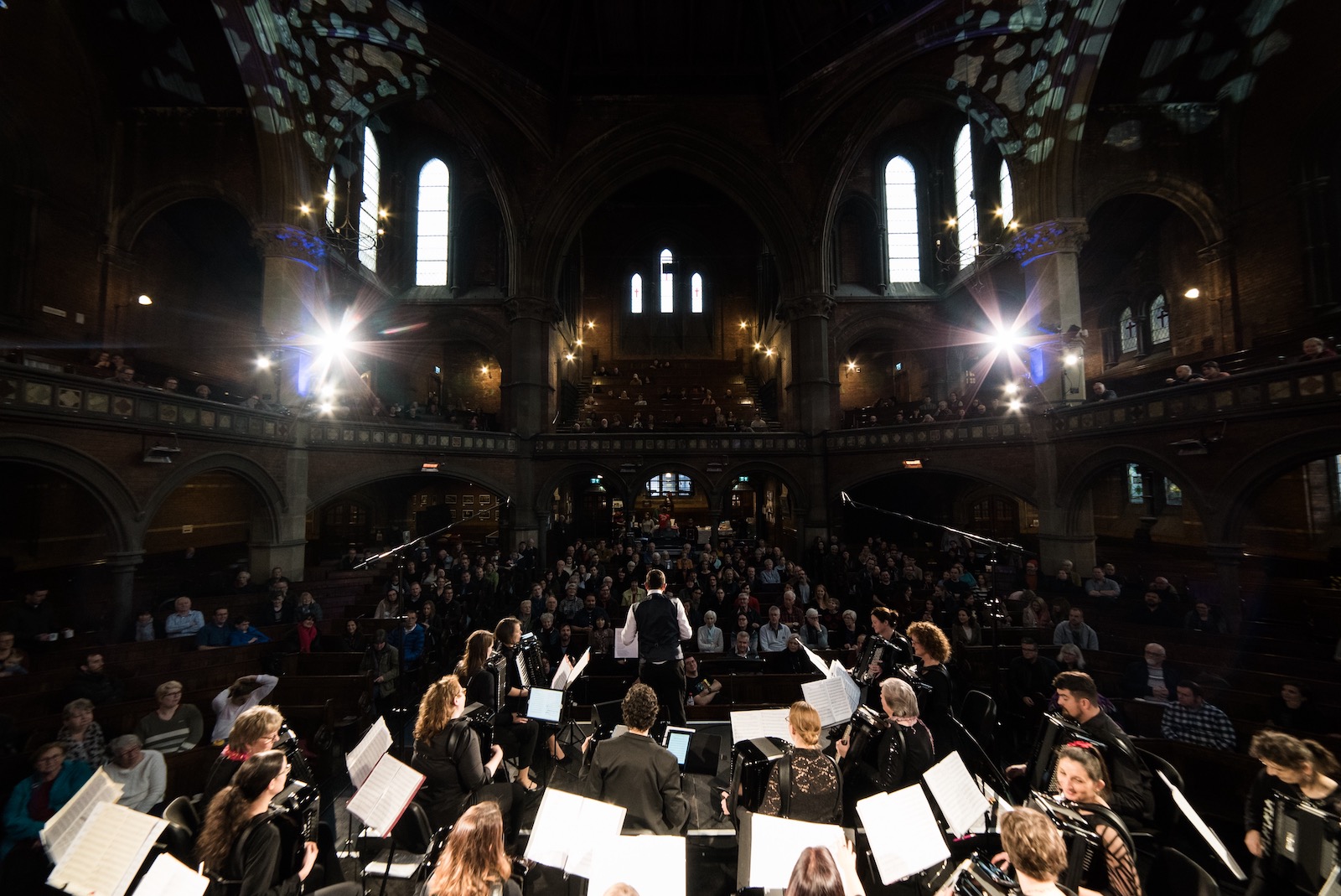 Image of the London Accordion Orchestra from behind, looking into Union Chapel