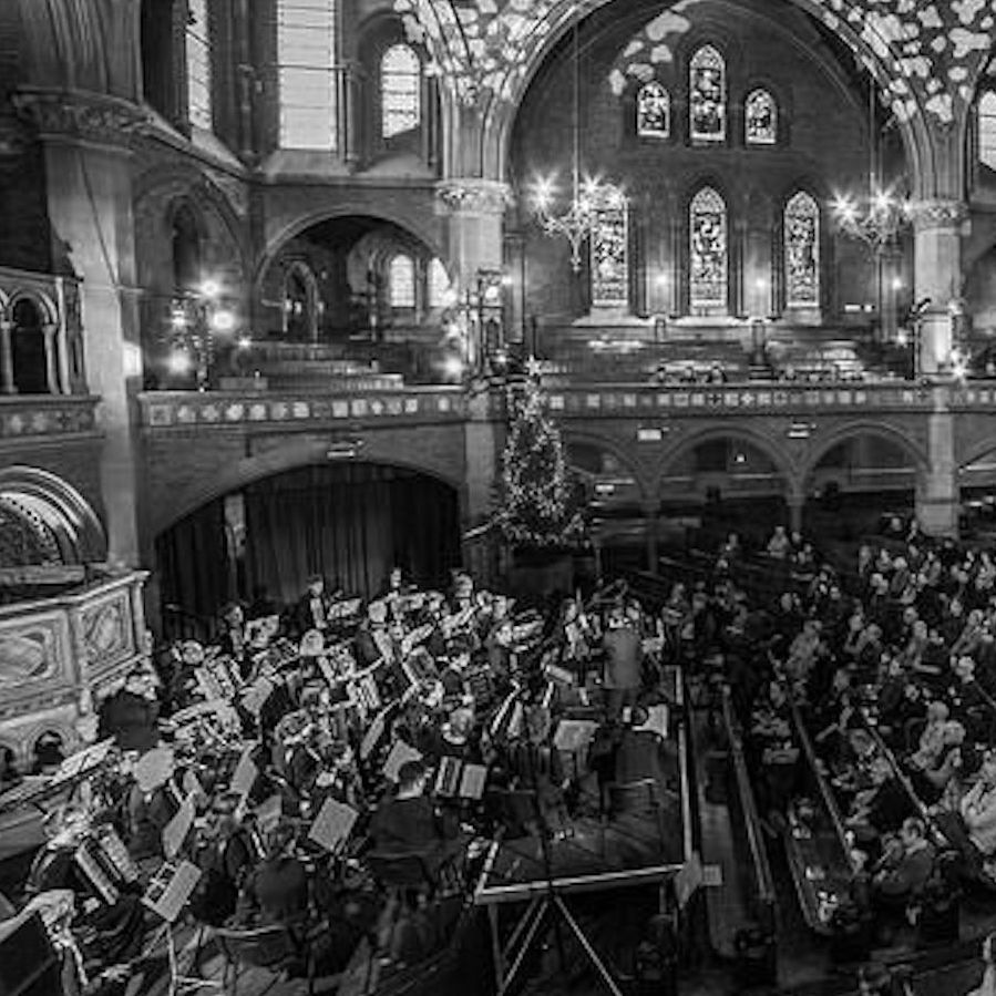 Image in black and white of the side of London Accordion Orchestra in concert at Union Chapel